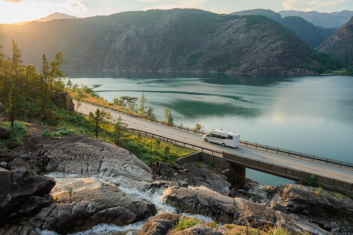 Scenic view of caravan trailer on road near Låtefossen  waterfall in Norway