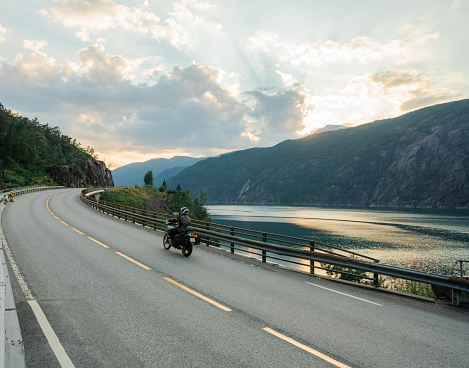 Scenic view of motorcycle  on bridge across the river in Norway