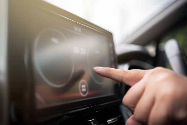 istock Driver touch car touchscreen to access application for automotive device 1487887219
