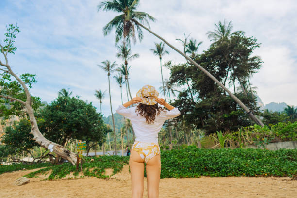 istock Woman walking on Railey beach and looking at stunning scenery 1487887267