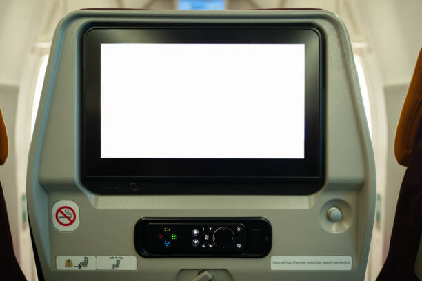 istock Blank LCD screen on airplane cabin for graphic display montage. 1487888140