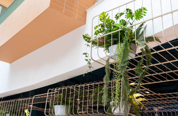 istock Outside the structure, a white iron rod is adorned with flower pots. 1487889414