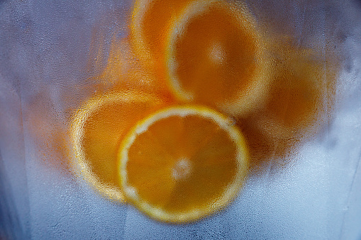 Ice cold water with orange slices