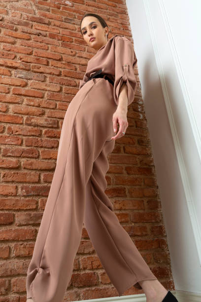 istock Beautiful brunette model wearing stylish outfit. 1487894590