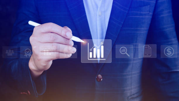 istock Big data analytics and business intelligence BI concept with chart and graph icons on digital screen interface and business people in the background. 1487894690