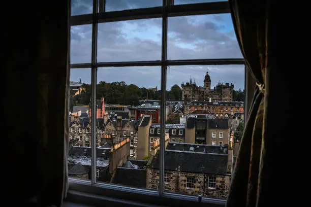 Edinburgh medieval cityscape seen from a window, with the George Heriot's School in the background.