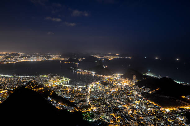 Aerial View of Rio de Janeiro Cityscape by Night Night view of Rio de Janeiro from the Corcovado Mountain corcovado stock pictures, royalty-free photos & images