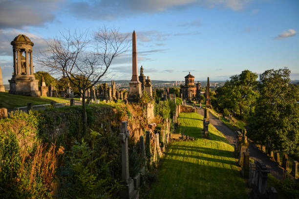 The Glasgow Necropolis is a Victorian cemetery in Glasgow, Scotland. It is on a low but very prominent hill to the east of Glasgow Cathedral (St. Mungo's Cathedral). Fifty thousand individuals have been buried here.
