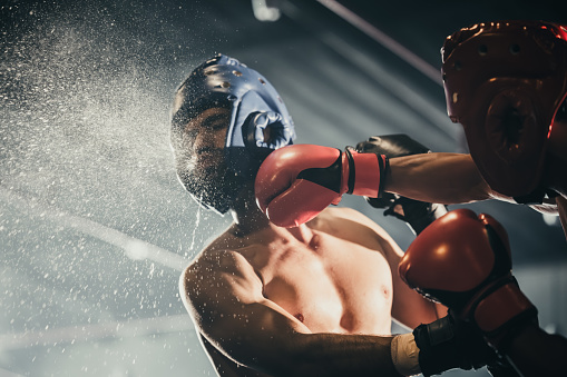 Boxer use various punch combinations, including the jab, hook, uppercut, cross, swing, straight. Getting in close to make opponent on ropes and knockout. Boxing champions win the round in boxing ring