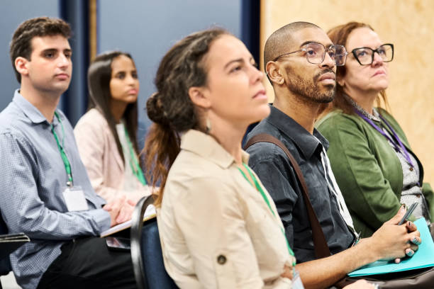 istock Diverse group of businesspeople at a conference 1487907594