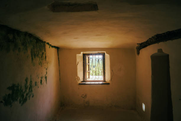 istock antique wooden window in a stone wall 1487907828