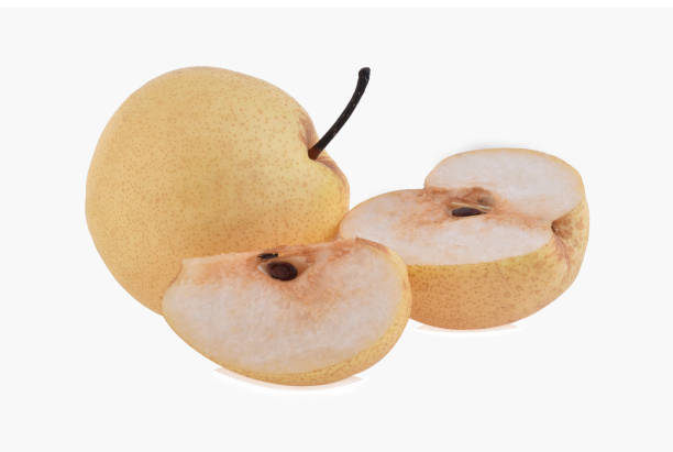 istock whole and half of chinese pear isolated on white background 1487909012