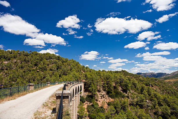 Via Verde (XXXL) The Via Verde is a recreational path for cycling, horse-riding and hiking that used to be a railroad track. It runs from the Terra Alta region in the province of Catalonia down to the banks of the Ebro river. via verde spain stock pictures, royalty-free photos & images