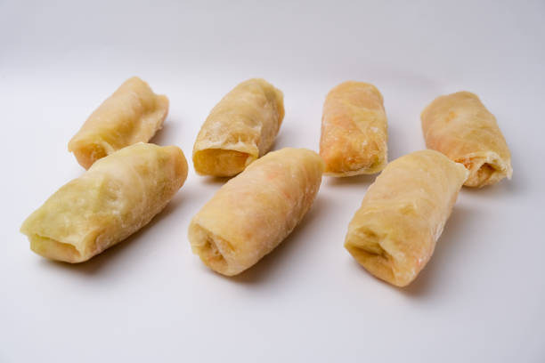Frozen cabbage rolls on a white background. Frozen food.