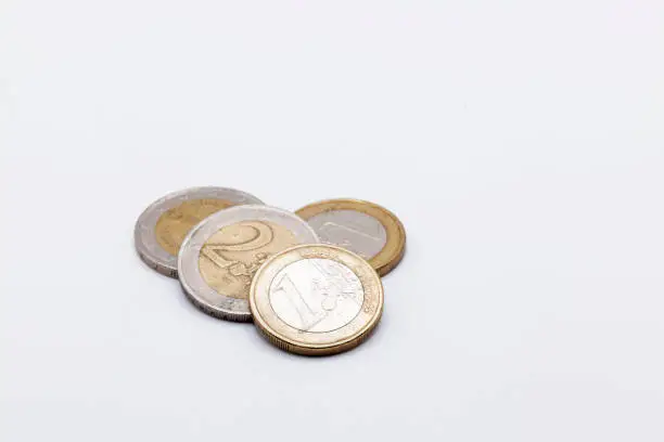 four euro coins on a white background