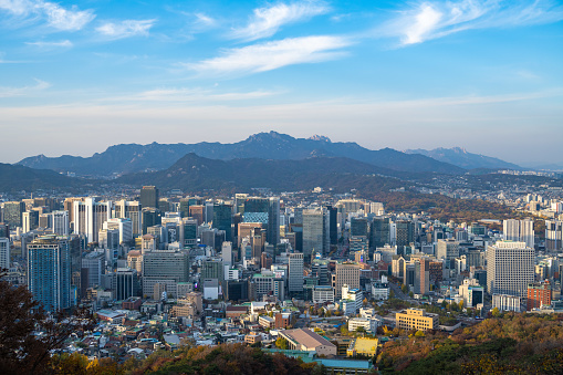 Aerial vista across the skyscrapers and landmarks, mountain parks and crowded suburbs of central Seoul, South Korea. ProPhoto RGB profile for maximum color fidelity and gamut.