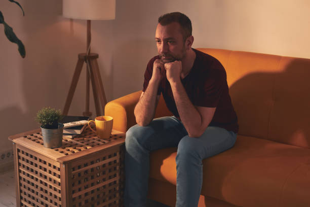 istock Bored man with lethargy and apathy sitting at home alone. 1487914075