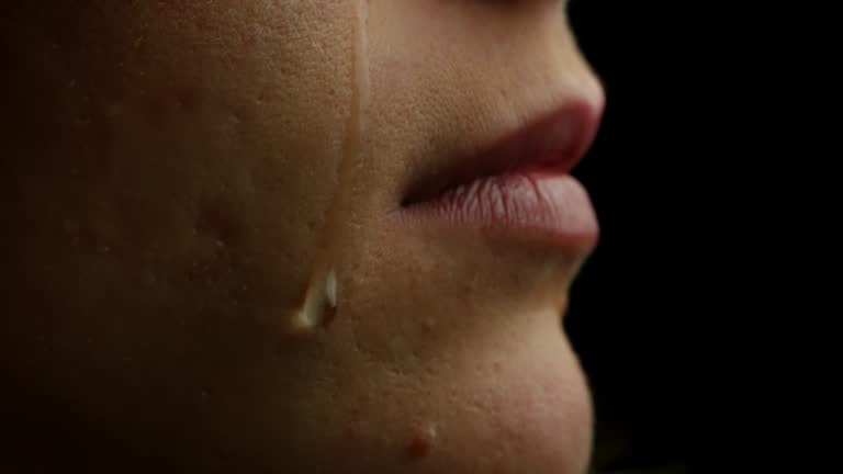 A Tear Running Down a Young Beautiful Woman Face, Macro