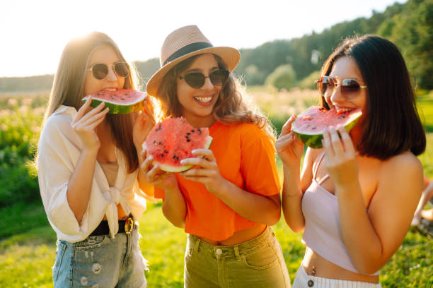 istock Three woman resting in nature in the picnic 1487916029