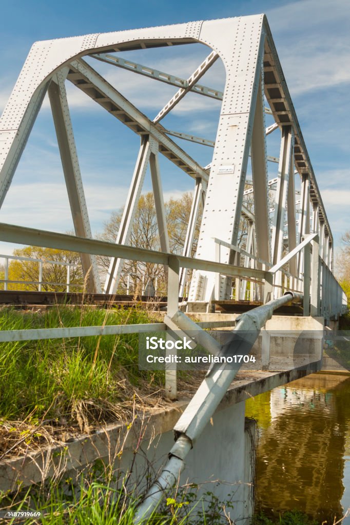 Poland, Upper Silesia, Disused Rail Bridge over Gliwice Canal, Springtime Poland, Upper Silesia, Disused Rail Bridge over Gliwice Canal, Gliwice Canal, Labedy-Dzierzno stretch, sunlit in spring Canal Stock Photo