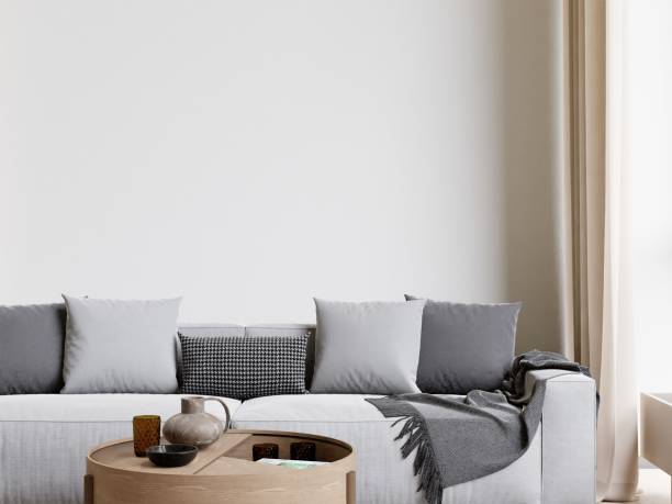istock 3D rendering of a modern living room with a comfortable sofa against the wall 1487920956