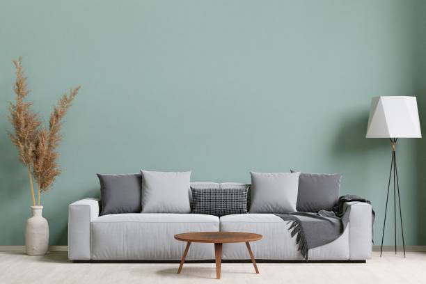 istock 3D rendering of a modern living room with a comfortable sofa against the wall 1487920994