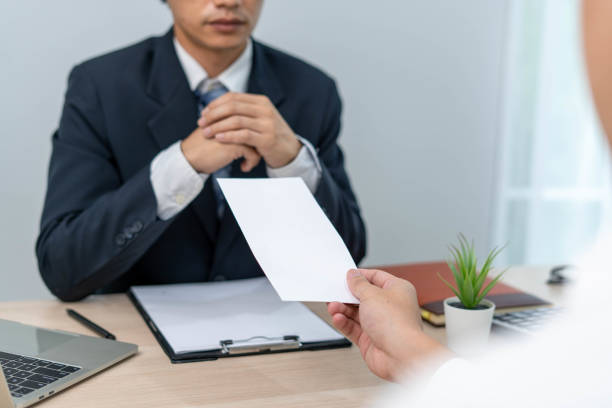 istock Businessmen send resignation letters to executives or managers. Include information about resignation and vacancies and job changes. 1487922076