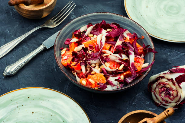 Salad with chicory and orange stock photo
