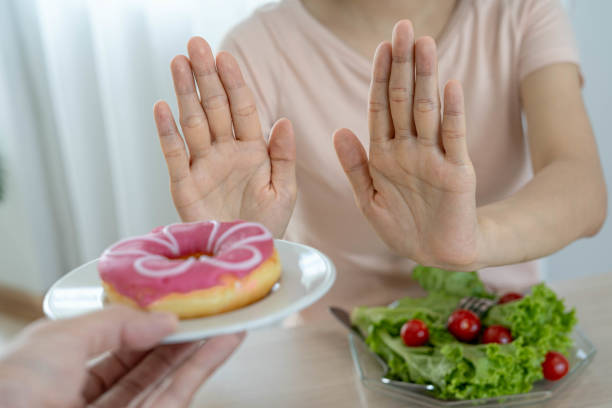 istock Women are determined to lose weight by refraining from starchy and sugary snacks. 1487924315