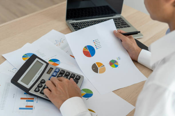 istock Business men looking at charts, spreadsheets, graph financial development, bank accounts, statistics, economy, data analysis, investment analysis, stock exchange 1487924476