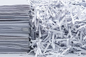 a pile of documentation next to the shredded papers