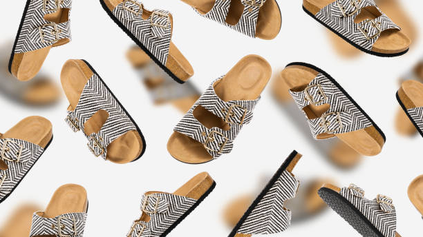 istock Summer Vegan cork sandals with straps flying from different sides on light gray background. Female trendy slippers. Eco-friendly natural shoes. Creative footwear template for design. Pattern 1487927637