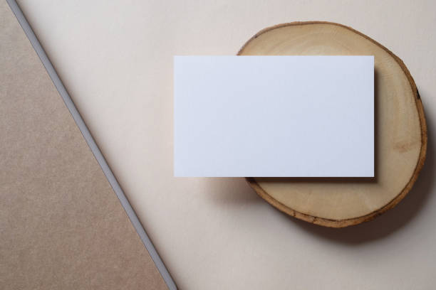 istock White blank business card mockup on beige background. 1487928580