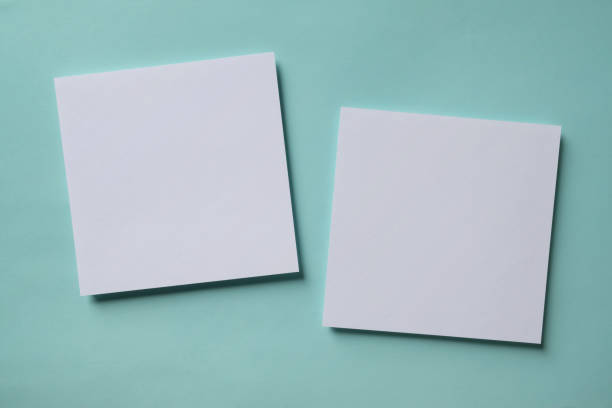 istock White blank greeting or invitation card mockup on blue background. Mock up presentation. 1487928595
