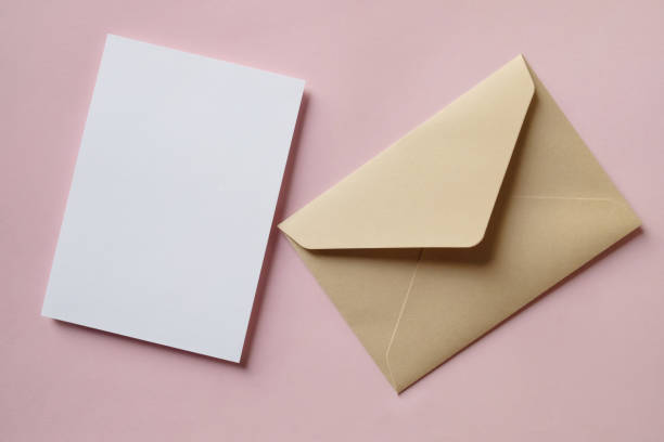 istock White blank greeting or invitation card and envelope on purple background. Mock up presentation. 1487928610