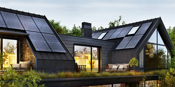 Modern house with roof terrace and solar panels