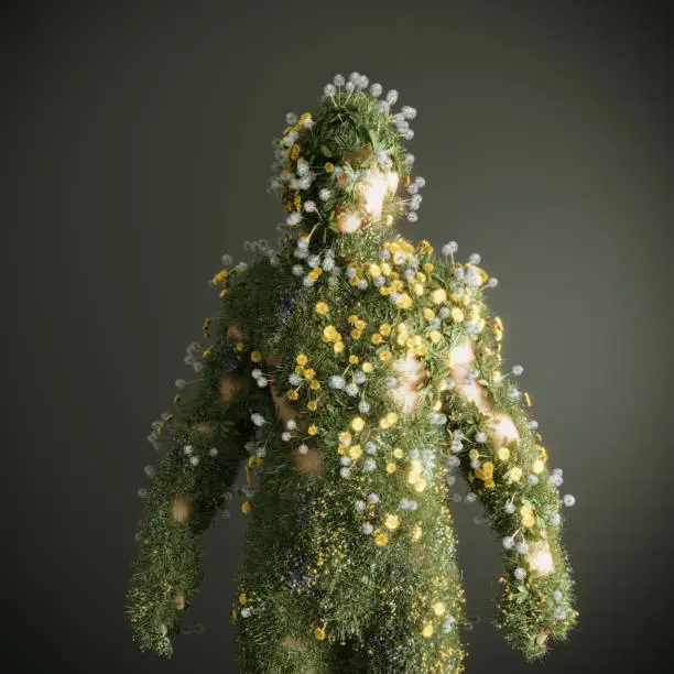 Photo of Human body made out of grass and flowers