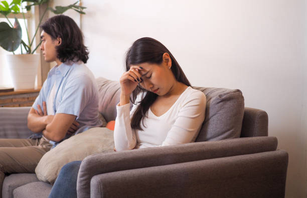 istock Couples feel angry and sad after fighting family problems. Selfish husbands and unhappy young wives bored with bad relationships. 1487935329