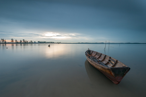 lonely boat, a ship that was stranded due to low tide