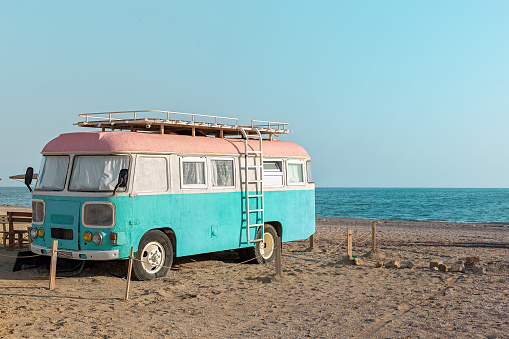 Vintage camper van parking at the beach on vacation in Azerbaijan, near Baku