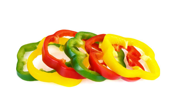 istock Sliced red, yellow, green bell pepper isolated on white background 1487937577