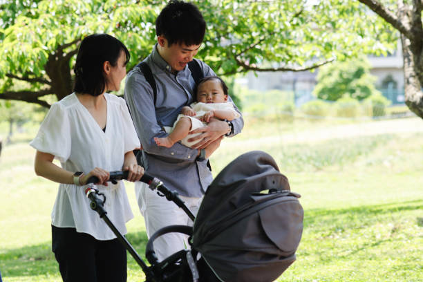 istock Young parent pushing a stroller with baby 1487938020