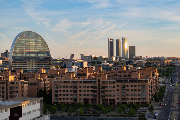 istock Beautiful panoramic view of Madrid, Spain at sunset with blue sky and sunlight reflections 1487941916