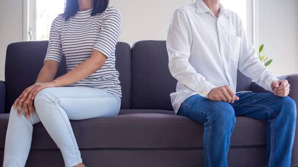 istock Upset couples sit separately on the sofa in the living room after an argument. The problem of love after marriage which leads to divorce 1487944449