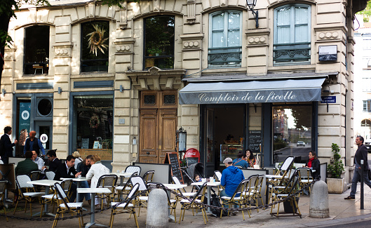 Lyon France: A sidewalk cafe with a father and baby—as well as other customers—adjacent to Vieux Lyon.