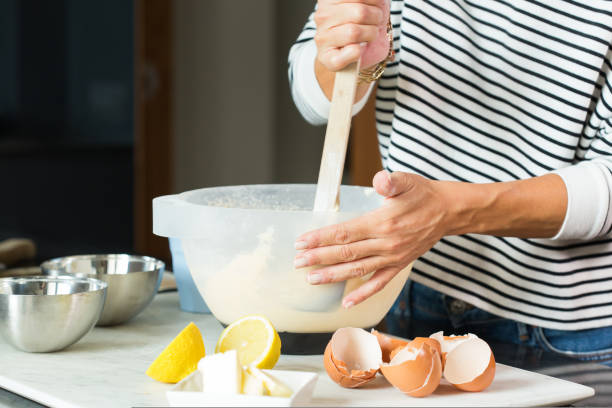 istock Woman hands kneading the dough while cooking apple pie 1487947955