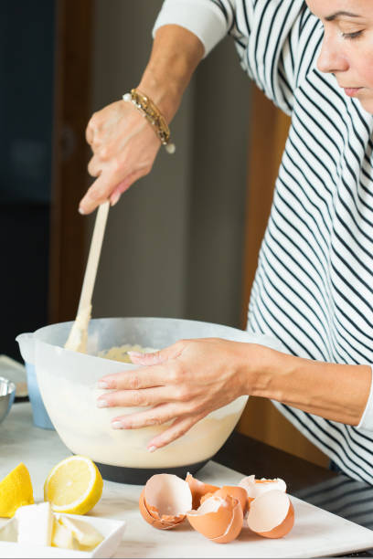 istock Woman hands kneading the dough while cooking apple pie 1487948559