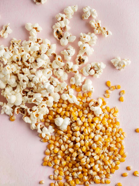 istock Corn kernels, Popcorn, Corn seeds and popcorn on background, Popcorn popped, Popcorn seed 1487951758