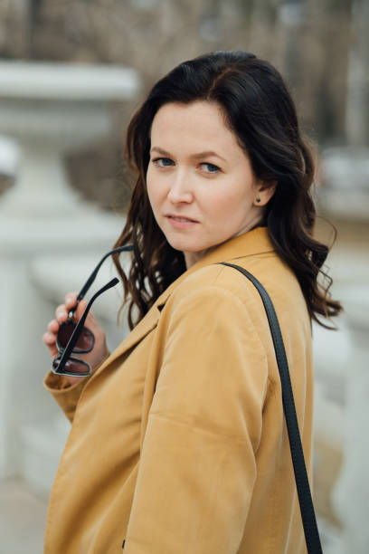 istock woman walking in the park 1487951989