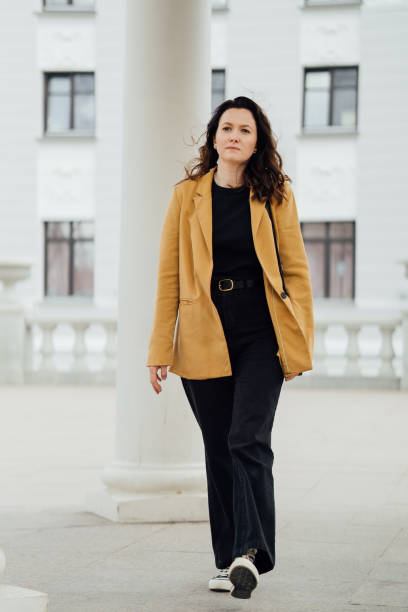 istock woman walking in the park 1487952076